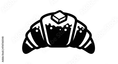 Delicious croissant with butter on top perfect for breakfast or a snack.