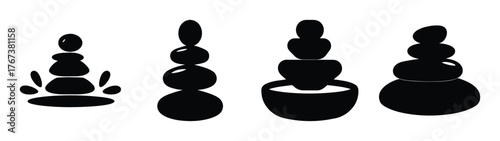 Set of four black zen stacked stones spa icon elements for relaxation and wellness