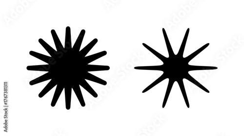 Two stylized black starburst shapes dynamic energy burst cosmic event graphic