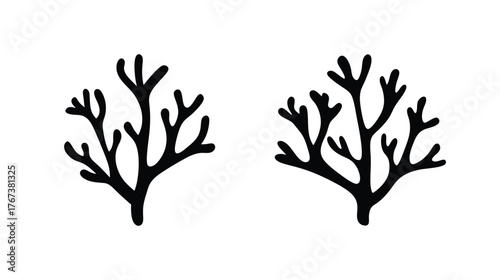 Two black silhouette branching coral reef organisms underwater aquatic life