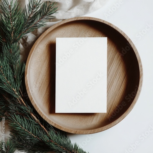 Blank Card Mockup on Wooden Plate with Pine Branch for Holiday Greetings and Invitations