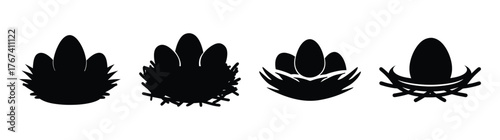 Fourblackabstractnestsilhouetteswitheggsartisticrepresentationspringeasternaturesymbolism