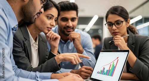 Indian business team collaborating over laptop — highlighting teamwork, strategy, and innovation