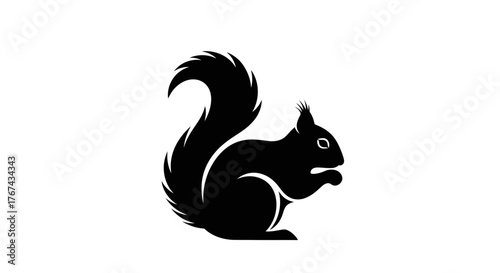 Black silhouette of a squirrel with a bushy tail holding food in its paws