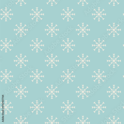 Winter seamless pattern of white snowflakes on light blue background. Doodle vector holiday illustration with hand drawn snow background.