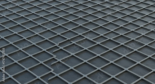 Metallic grid with diamondshaped openings over a dark surface Irregular edges visible