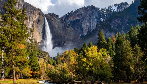 Beautiful waterfall in mountain valley surrounded by colorful autumn forest