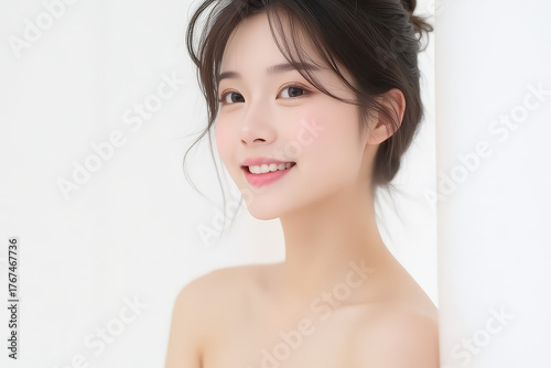 Female Asian Model with Short Hair - Young Beautiful Woman with Hair Bun - Studio Portrait of Asian Beauty for Fashion, Cosmetic, Skincare - Posing on White Background - Smooth Tied Hair