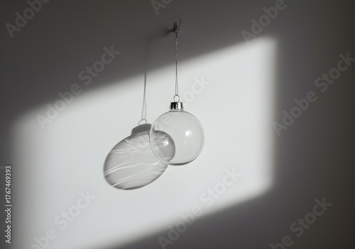Transparent Ornament Casting Shadow and Light Patterns on Wall