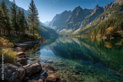 Fototapeta Naklejka Na Ścianę i Meble -  Serene view of Morskie Oko lake surrounded by mountains in Tatra National Park, Poland, on a sunny day