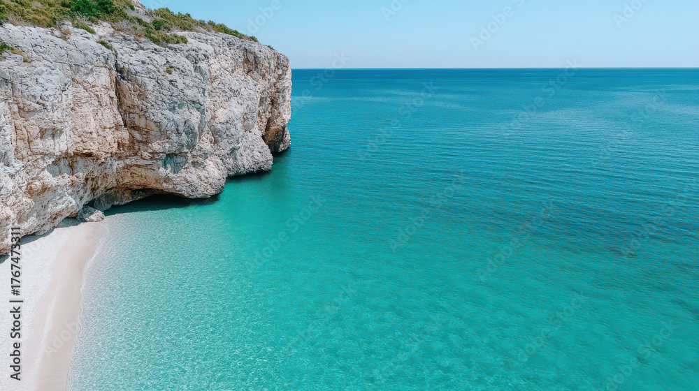 Obraz premium Turquoise sea meets rocky cliffs serene coastal landscape, inviting tranquility and exploration