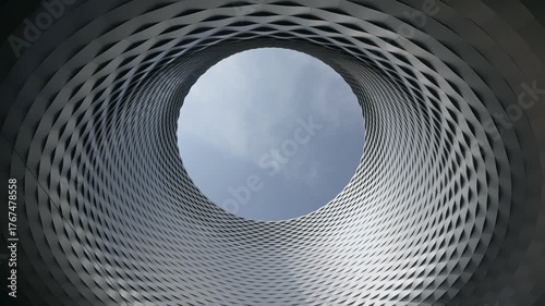 Basel, Switzerland — Contemporary architecture of Messe Basel, the city’s modern expo and trade fair complex, showcasing its iconic circular opening and aluminum facade