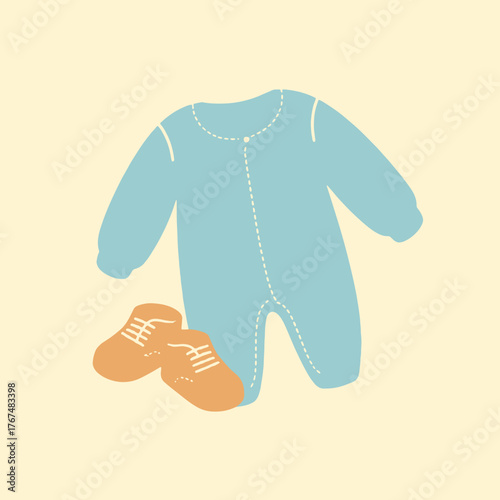 Charming set of baby clothes soft blue sleepsuit and cute tiny booties perfect for newborn essentials and nursery decor