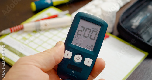 A person checks their blood sugar level using a glucometer, revealing a very high reading. The importance of monitoring glucose for diabetes management is highlighted.