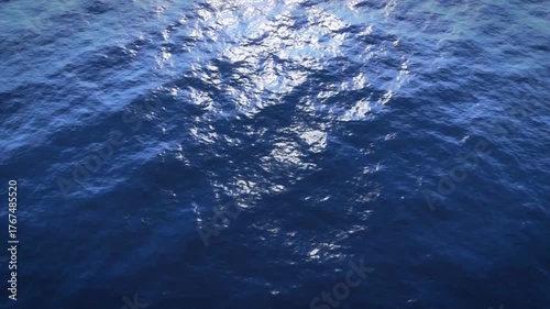 Pacific ocean waves arrive with a glimmer from the sun top view