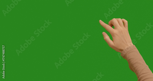 Konstfotografi Hand swiping on chroma key green screen background