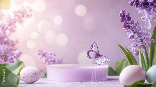 A soft purple podium with lilac flowers and Easter eggs on a purple background
