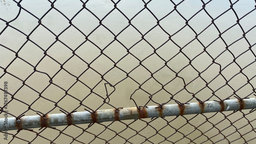 Fototapeta premium chain link fence and barbed wire