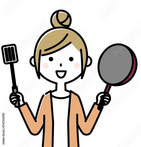 フライパンを持つ若い女性　料理