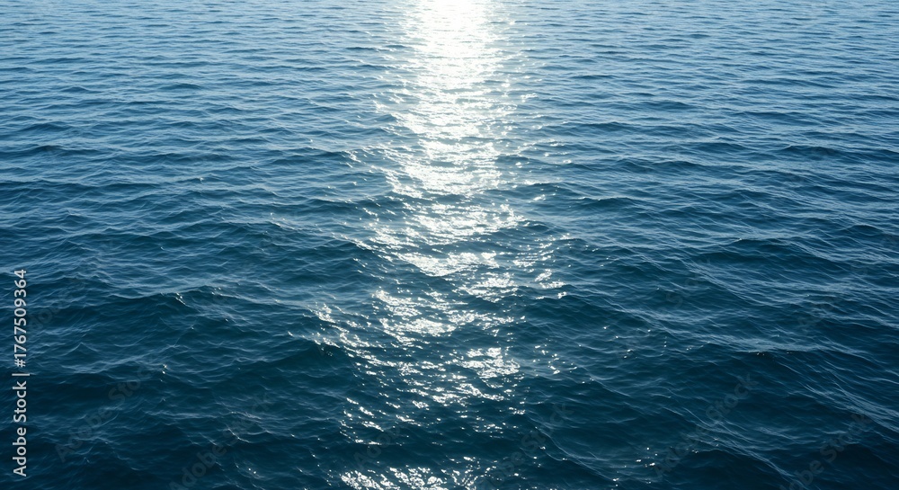 Naklejka premium Sunlit ocean water ripples a textured blue expanse with a bright reflective center
