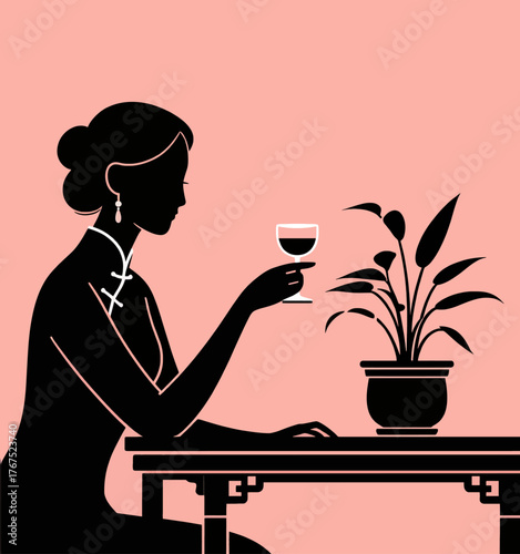 Silhouette of woman in traditional dress holding wine glass at table with plant