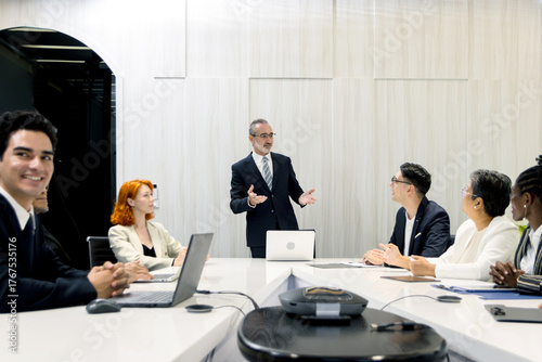 Group of diverse businesspeople at conference, happy business workers discussing and brainstorming together at meeting room. Cheerful officers exchange ideas and listen to presentations during meeting