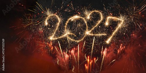 happy new year, new year's eve, silvester, new year, celebration greeting card, new year card - Year 2027 in sparkler font and firework fireworks pyrotechnic, isolated on black night sky background