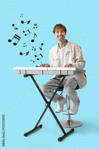 Young tattooed man playing ...