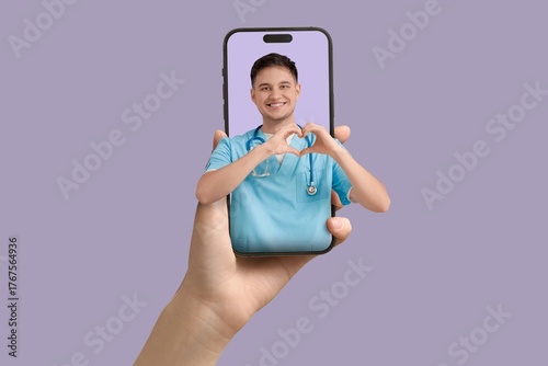 Patient holding smartphone ...