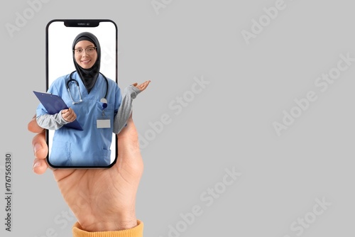 Patient holding smartphone ...