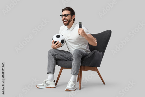 Young man with 3D glasses a...