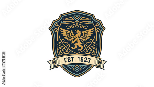 A heraldic emblem featuring a winged lion, ornate frame with scrollwork, and a ribbon