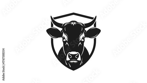 A striking black and white image depicts a cow's head encircled by a shield-shaped frame
