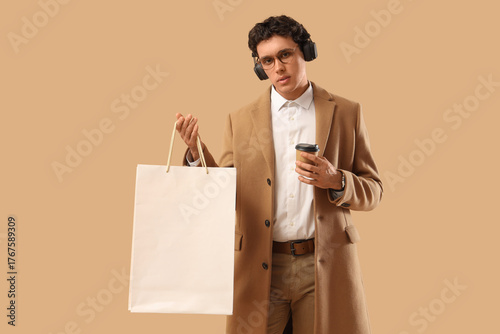 Stylish young man in headph...