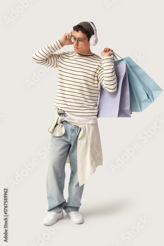 Stylish young man in headph...