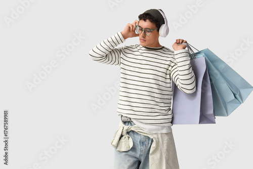 Stylish young man in headph...