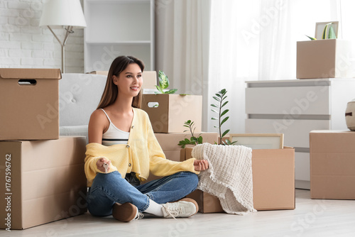Young woman with cardboard ...