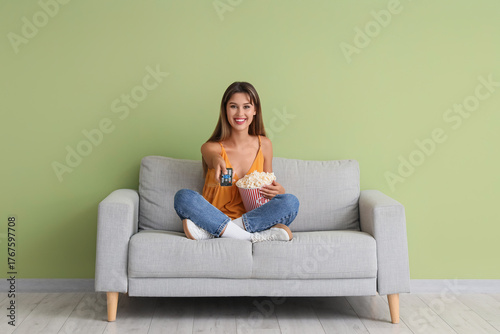 Young woman with remote con...