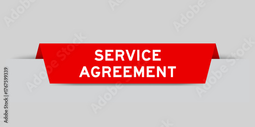 Red color inserted label with word service agreement on gray background