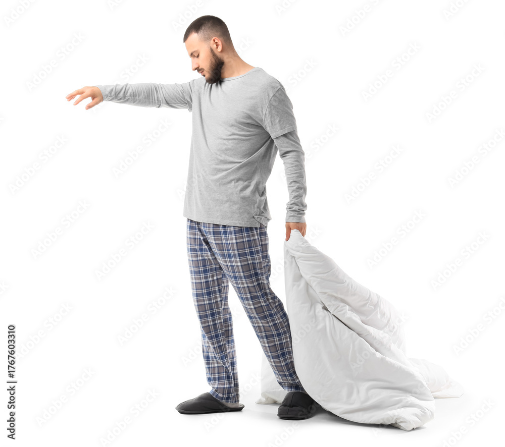 Naklejka premium Male sleepwalker in pajamas with blanket on white background