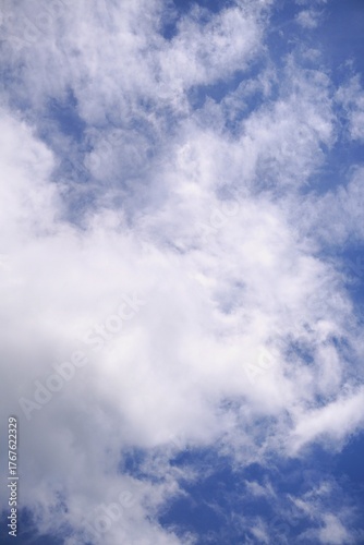 Fluffy White Clouds Against a Vibrant Blue Sky.