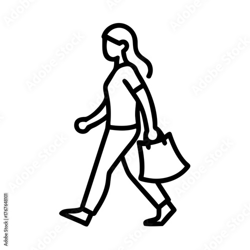 Woman walking with reusable shopping bag carrying groceries