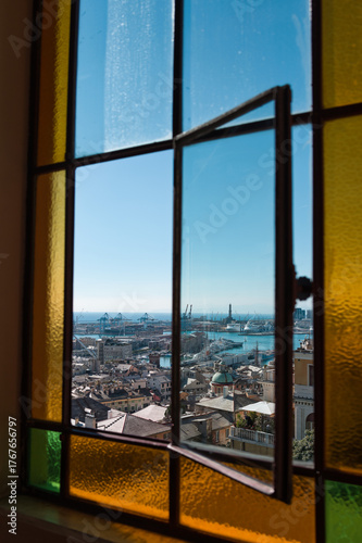 Genoa with lighthouse through a beautiful window in Italy with blue sky