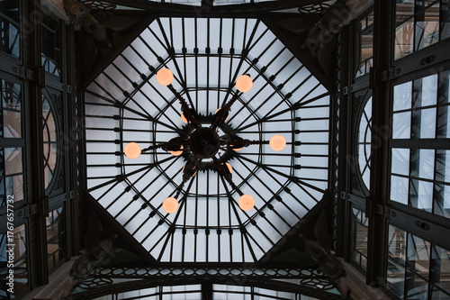 glass and steel ceiling with chandelier from below in the city of Genoa