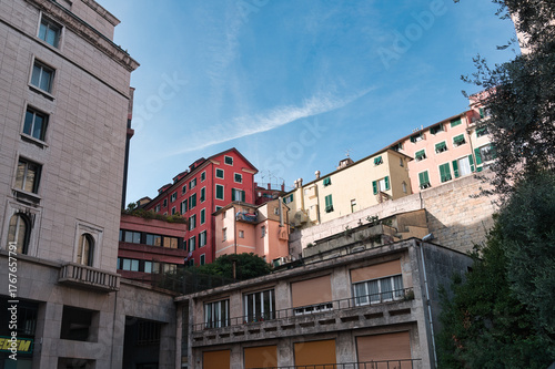 Buildings in the city of Genoa under a blue sky in the morning