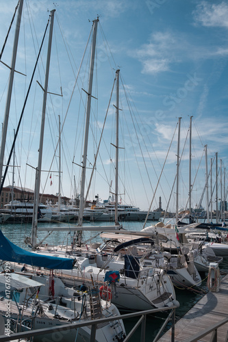 Port of Genoa with sailing ships and the lighthouse in the background