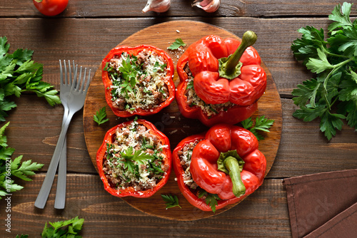 Baked stuffed red bell peppers with minced meat, rice, parmesan