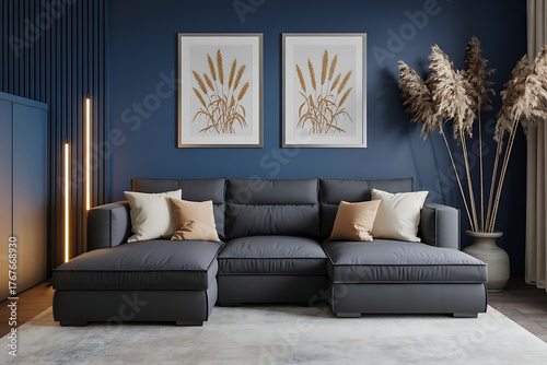 Modern and attractive style living room with deep blue wall, framed wheat art, deep gray sofa, pampas grass, and cozy lighting.