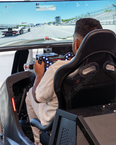 Man Driving Racing Simulator at Porsche Experience Centre