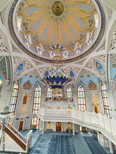  Kazan Kremlin, Kazan, Russia, July 26,2024: Kul Sharif Mosque, the main prayer hall with its huge blue-and-gold chandelier, Islamic geometric patterns, and stained-glass windows.